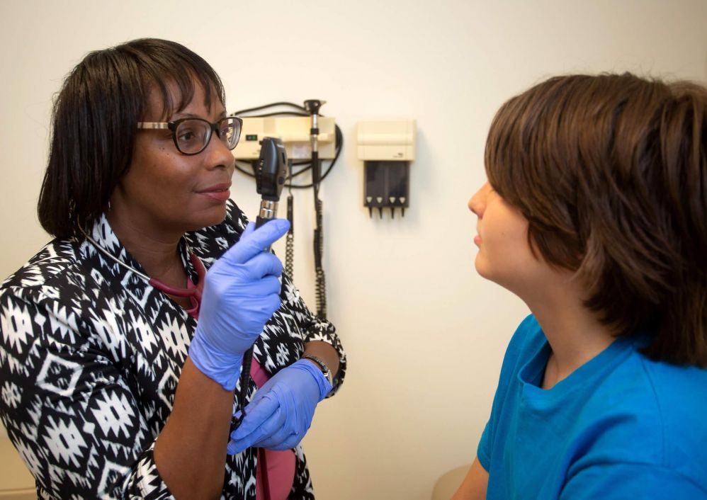 Katrina L. Roberson-Trammell, M.D., treats a patient.