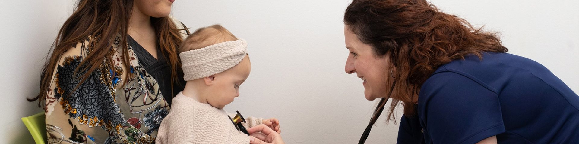 Katherine Nobles Spadafora, M.D., examines a patient.