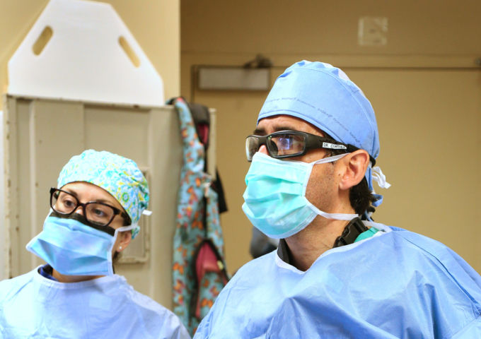 Steve Cordina, M.D., performes a procedure at USA Health University Hospital.