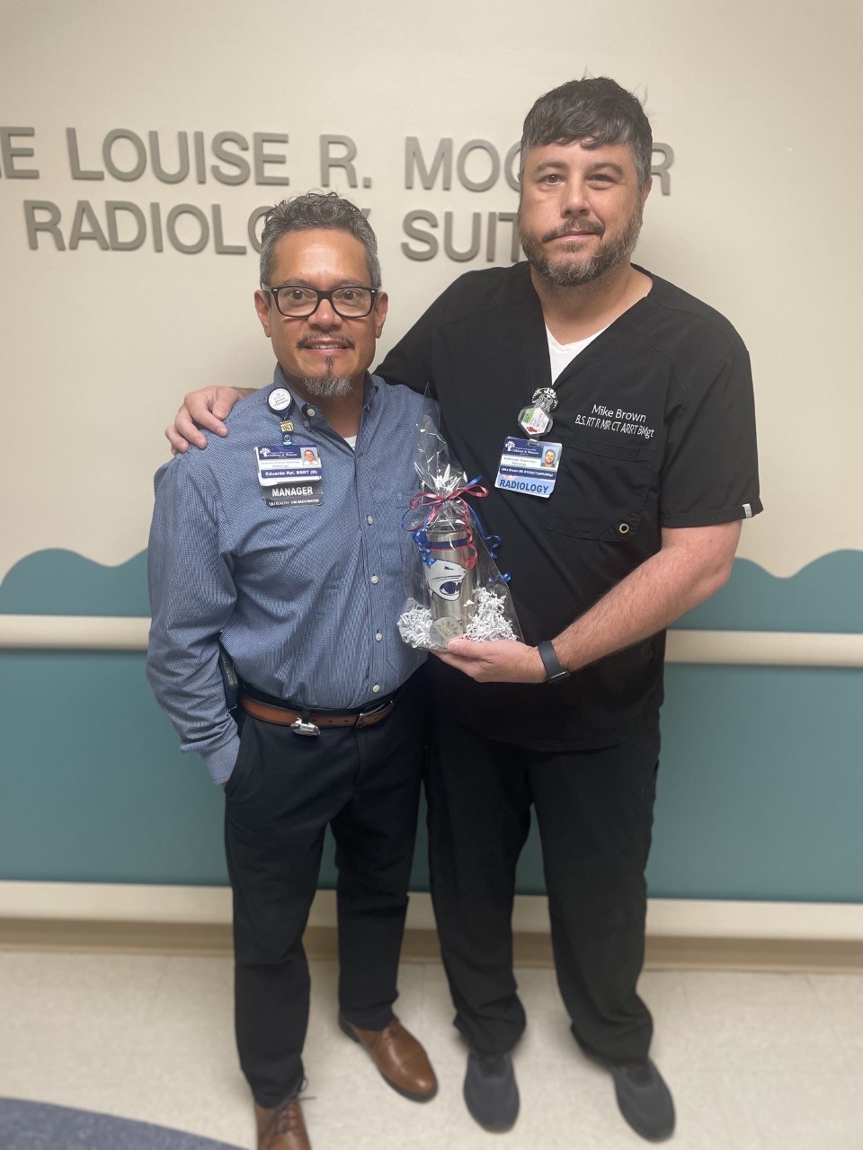 Mike Brown, radiologic supervisor at Children’s & Women’s Hospital, was named a Cheers for Peers winner. Brown, right, is shown with Eduardo Rel, radiology manager.